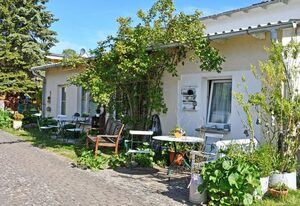 Ferienwohnungen mit Kamin und Blick zum Selliner Seepark – Ferienwohnung mit Balkon und Kamin Donnerkeil