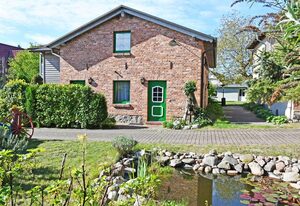 Ferienwohnungen mit Kamin und Blick zum Selliner Seepark – Ferienwohnung mit Balkon und Kamin Donnerkeil
