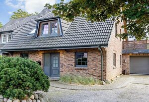 Dünen Lodge – Moderne Erdgeschosswohnung mit großzügiger Terrasse und eigenem Garten