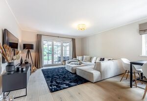 Dünen Lodge – Moderne Erdgeschosswohnung mit großzügiger Terrasse und eigenem Garten