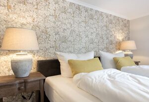 Haus Weissenburg Whg. Garten Ost – Moderne, strandnahe 3-Zimmer-Ferienwohnung auf ca. 80 m² für bis zu 3 Personen
