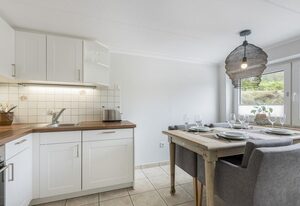 Haus Weissenburg Whg. Garten Ost – Moderne, strandnahe 3-Zimmer-Ferienwohnung auf ca. 80 m² für bis zu 3 Personen
