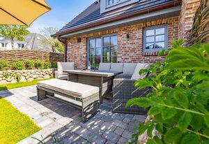 Haus Rosi – Ferienhaushälfte in Westerland mit Sauna und Garten. Haustiere sind Willkommen.
