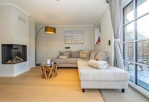 Haus Rosi – Ferienhaushälfte in Westerland mit Sauna und Garten. Haustiere sind Willkommen.