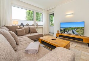 Ferienliebe Westerland – 3-Zimmer-Ferienwohnung für bis 4 Personen mit Balkon.