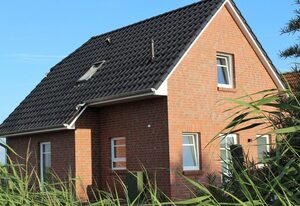 Meer & Mehr – 85qm Ferienhaus für 4 Personen mit Infrarotkabine, Terrasse und Garten am Deich