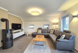 Ferienhaus Urlaubsglück Neßmersiel – Modernes Ferienhaus mit Kamin, Garten und familienfreundlicher Ausstattung