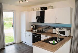 Haus Nr. 40, Ferienhaus Deichgraf – Modernes Ferienhaus, Kamin, Sauna, Süd-Terrasse, Loggia mit Meerblick, Haustiere