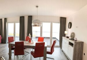 49.6.N Dwarslöper – Moderne Ferienwohnung, Kamin, Sauna, großer Balkon, Meerblick, strandnah