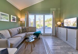 Feriendorf Südstrand – Sonne, Strand & Sauna – Lütt Strandhuus Pelzerhaken mit Kamin und Garten