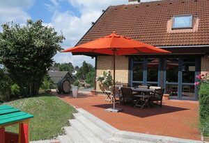Haus Timpenbarg – Familienfreundliches Ferienhaus in Pelzerhaken mit Garten, großzügigem Wohnbereich, separatem Kaminzimmer und Sauna