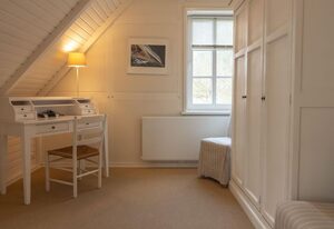 Apparthotel Seehof Lütt Hus – Großes freistehendes Ferienhaus für sechs Personen mit Terrasse und Seeblick