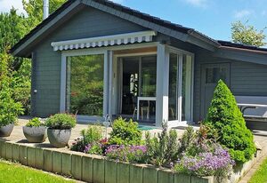 Blockhaus mit Wintergarten und Kamin – Blockhaus in Damp