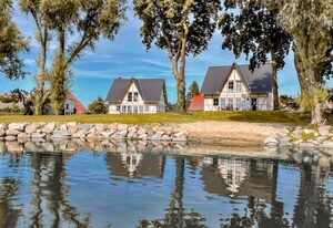 Watermark Usedom - Premium Ferienhaus direkt am Wasser mit eigener Badestelle - Haus Welle