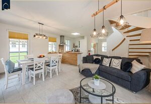 Ferienhaus JoHann – Modernes Ferienhaus im Fischerdorf im Grünen mit Sauna, Garten & Platz für 4 Personen