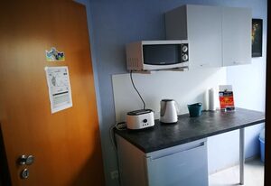 Gästezimmer Sieg – Dreibettzimmer mit Doppelbett und Schlafsofa.