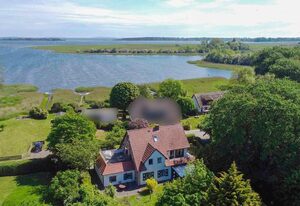 Ferienwohnung - Rügenbrise am Wasser mit Steg und Paddelboot - alles inklusive