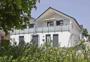 FeWo Helligdom – moderne Ferienwohnung mit Balkon und Meerblick - Ferienwohnung Helligdom