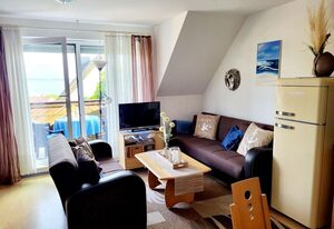 Ferienwohnung Boddenblick - Balkon und Wasserblick – Ferienwohnung Boddenblick: Ihr Rückzugsort in Breege mit Blick auf den Bodden