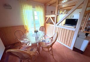 Wohnung Nele 2 direkt am Bodden mit Terrasse – Terrassenwohnung für 2 Personen mit Kamin, Wasserblick und Strandzugang